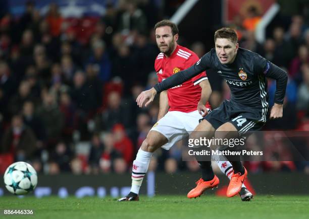 Juan Mata of Manchester United in action with Kirill Nababkin of CSKA Moscow during the UEFA Champions League group A match between Manchester United...