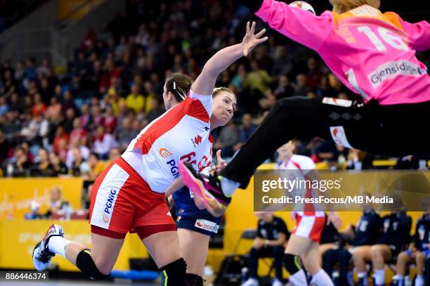 Joanna Szarawaga of Poland and Katrine Lunde of Norway in action during IHF Women's Handball World Championship group match between Poland and Norway...