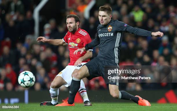 Juan Mata of Manchester United in action with Kirill Nababkin of CSKA Moscow during the UEFA Champions League group A match between Manchester United...