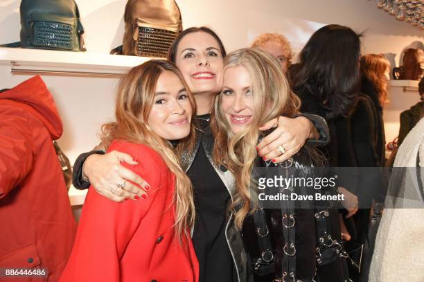 Miroslava Duma, Livia Firth and Carmen Busquets attend the opening of the BOTTLETOP flagship store on Regent Street on December 5, 2017 in London,...