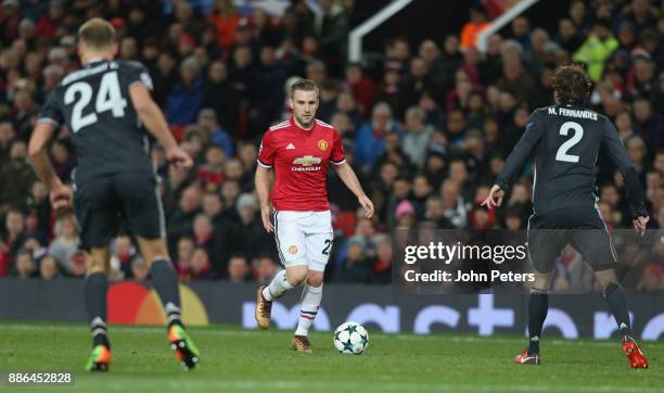 Luke Shaw of Manchester United in action with Vasili Berezutski and Mario Fernandes of CSKA Moscow during the UEFA Champions League group A match...