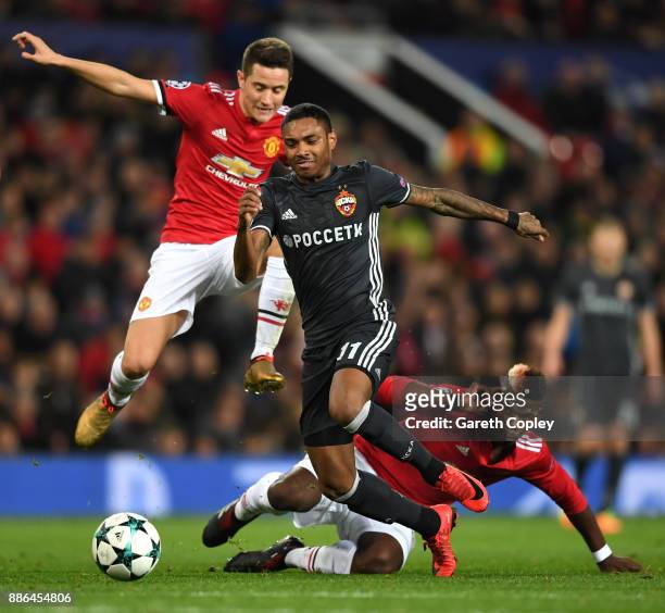 Vitinho of CSKA Moscow escapes the challenge of Paul Pogba of Manchester United and Ander Herrera of Manchester United during the UEFA Champions...
