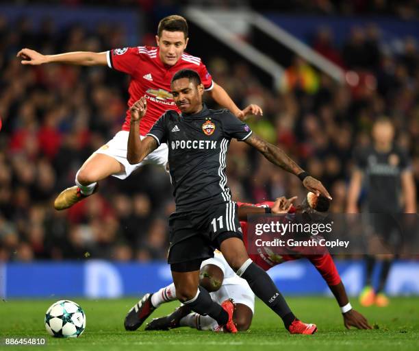 Vitinho of CSKA Moscow escapes the challenge of Paul Pogba of Manchester United and Ander Herrera of Manchester United during the UEFA Champions...