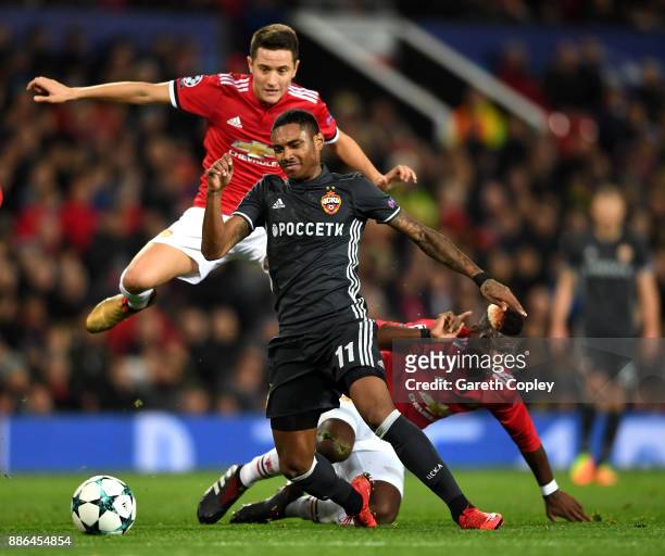 Vitinho of CSKA Moscow escapes the challenge of Paul Pogba of Manchester United and Ander Herrera of Manchester United during the UEFA Champions...