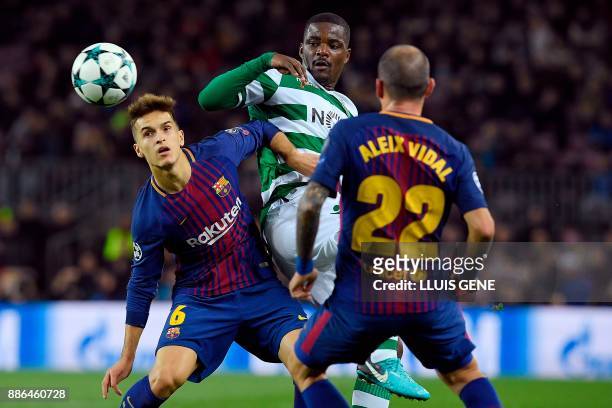 Sporting's Portuguese midfielder William Carvalho challenges Barcelona's Spanish midfielder Denis Suarez and Barcelona's Spanish midfielder Aleix...