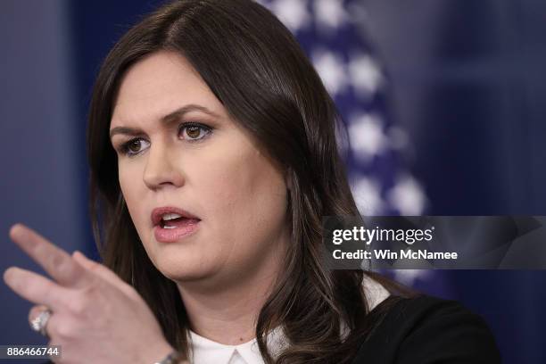 White House press secretary Sarah Huckabee Sanders answers questions during the daily briefing at the White House on December 5, 2017 in Washington,...