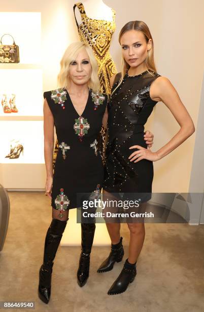 Donatella Versace and Natasha Poly attend the Versace Boutique Opening on Sloane Street on December 5, 2017 in London, England.