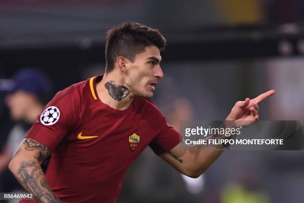 Roma's Argentinian midfielder Diego Perotti celebrates after scoring during the UEFA Champions League Group C football match AS Roma vs FK Qarabag on...