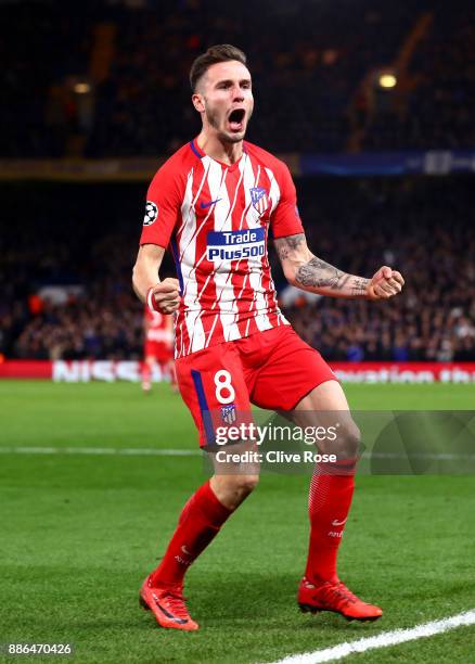 Saul Niguez of Atletico Madrid celebrates after scoring his sides first goal during the UEFA Champions League group C match between Chelsea FC and...