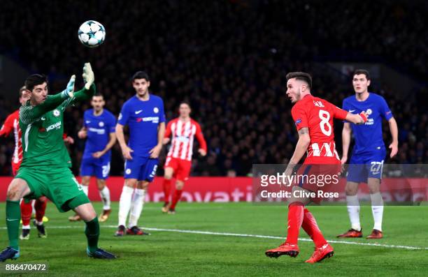 Saul Niguez of Atletico Madrid scores his sides first goal past Thibaut Courtois of Chelsea during the UEFA Champions League group C match between...