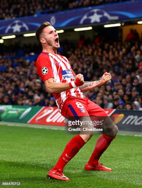 Saul Niguez of Atletico Madrid celebrates after scoring his sides first goal during the UEFA Champions League group C match between Chelsea FC and...