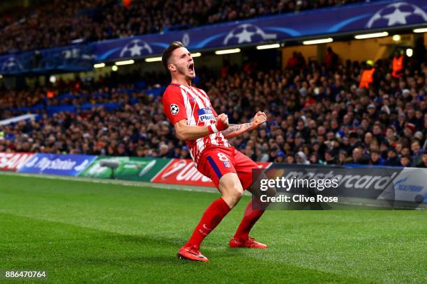 Saul Niguez of Atletico Madrid celebrates after scoring his sides first goal during the UEFA Champions League group C match between Chelsea FC and...