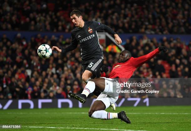 Romelu Lukaku of Manchester United scores his sides first goal while under pressure from Viktor Vasin of CSKA Moscow during the UEFA Champions League...