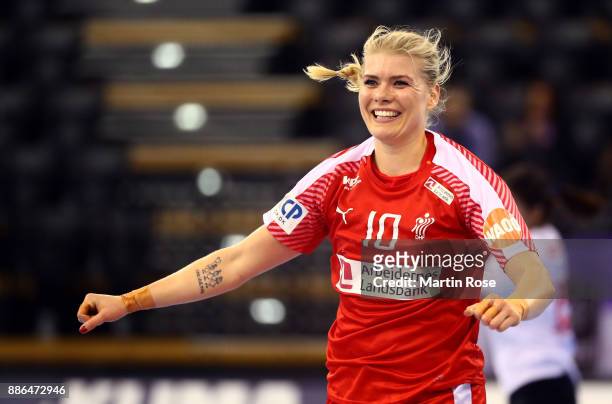 Kathrine Heindahl of Denmark celebrates after scoring a goal during the IHF Women's Handball World Championship group C match between Denmark and...