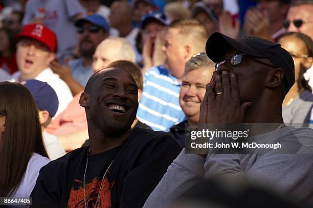 Closeup of Los Angeles Lakers basketball player Kobe Bryant with his father Joe Bryant during Los Angeles Angels of Anaheim vs Los Angeles Dodgers...