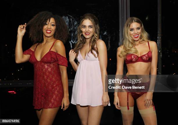 Models pose at the launch of Pamela Anderson's exclusive Coco De Mer collection at Morton's on December 5, 2017 in London, England.