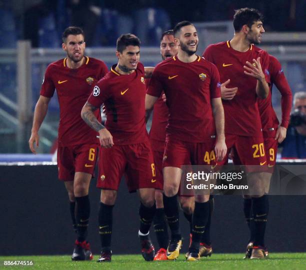 Diego Perotti with teammates of AS Roma celebrates after scoring the opening goal during the UEFA Champions League group C match between AS Roma and...
