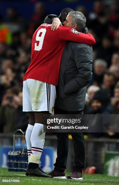 Romelu Lukaku of Manchester United embraces Jose Mourinho, Manager of Manchester United after being subbed during the UEFA Champions League group A...