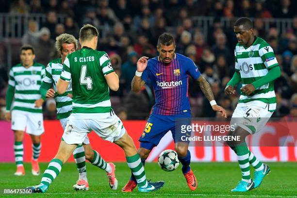 Barcelona's Brazilian midfielder Paulinho challenges Sporting's Portuguese midfielder Fabio Coentrao , Sporting's Uruguayan defender Sebastien Coates...