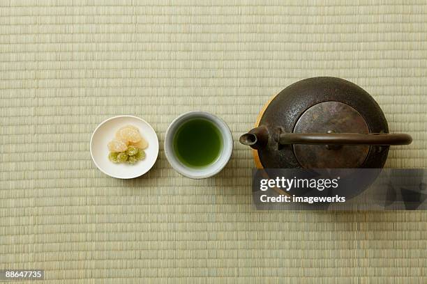 japanese green tea with kettle on tatami, close-up  - japanese sweet stock pictures, royalty-free photos & images