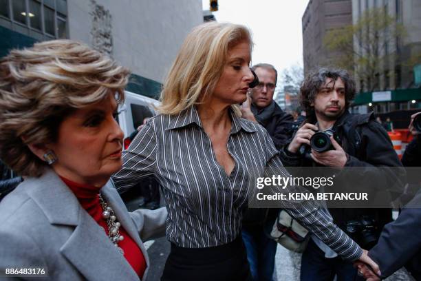 Summer Zervos a former contestant on "The Apprentice" walks next to lawyer Gloria Allred after they leave the New York County Criminal Court on...