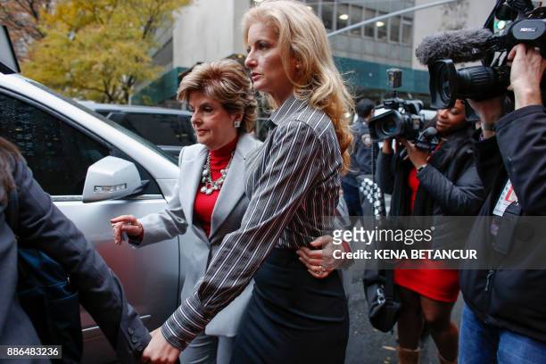 Summer Zervos a former contestant on "The Apprentice" walks next to lawyer Gloria Allred after they leave the New York County Criminal Court on...