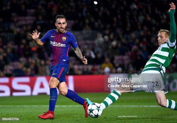 Paco Alcacer of Barcelona shoots and Jeremy Mathieu of Sporting Lisbon deflects it in for a own goal and Barcelona's second goal during the UEFA...