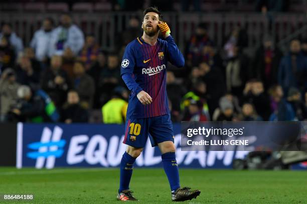 Barcelona's Argentinian forward Lionel Messi reacts at the end of the UEFA Champions League football match FC Barcelona vs Sporting CP at the Camp...