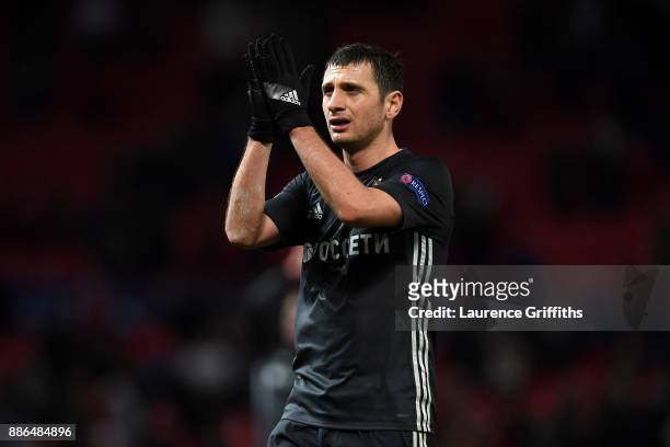 Alan Dzagoev of CSKA Moscow shows appreciation to the fans after the UEFA Champions League group A match between Manchester United and CSKA Moskva at...
