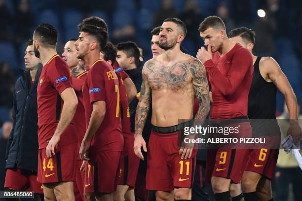 Roma's Croatian defender Aleksandar Kolarov celebrates with teammates at the end of the UEFA Champions League Group C football match AS Roma vs FK...