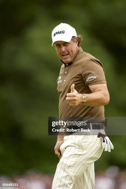 Phil Mickelson victorious after making putt during Final Round on Monday at Bethpage Black. Tournament ended a day late due to weather delay....