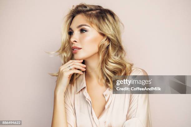 blond woman with perfect skin - blonde hair on tan skin stock pictures, royalty-free photos & images