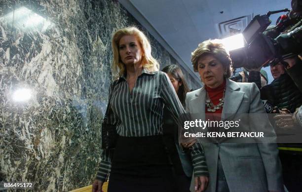 Summer Zervos a former contestant on "The Apprentice" walks next to lawyer Gloria Allred after they leave the New York County Criminal Court on...