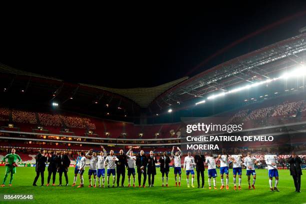 Basel's players celebrate at the end of the UEFA Champions League football match SL Benfica vs FC Basel at the Luz stadium in Lisbon on December 5,...