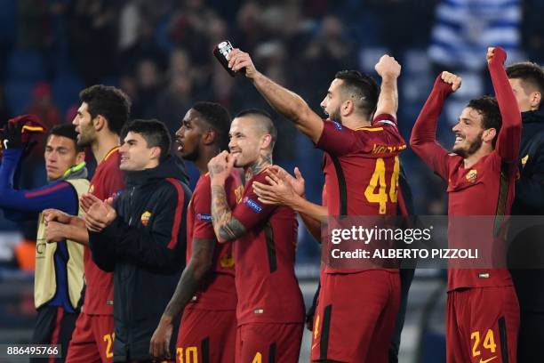 Roma's players celebrate at the end of the UEFA Champions League Group C football match AS Roma vs FK Qarabag on December 5, 2017 at the Olympic...