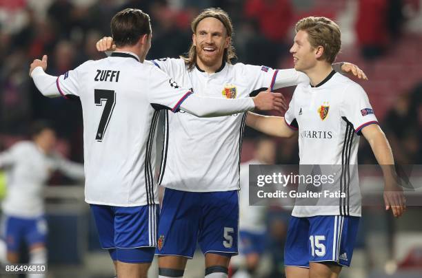 Fc Basel defender Michael Lang from Switzerland celebrates the victory with teammates Fc Basel midfielder Alexander Fransson from Sweden and Fc Basel...