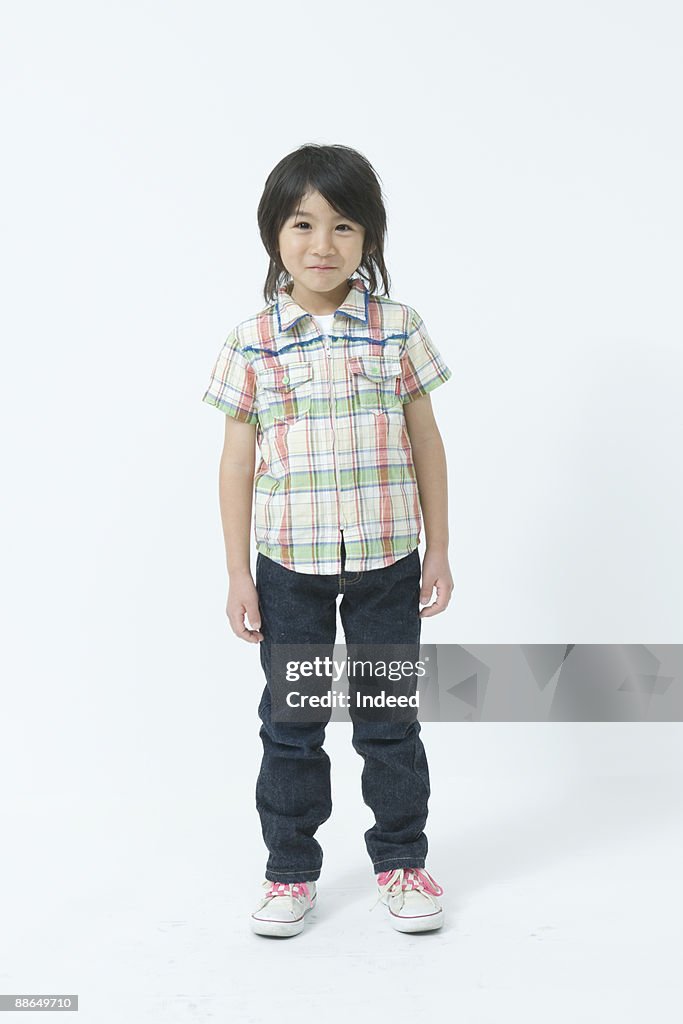 Portrait of Japanese boy ( 8-9 years), full length