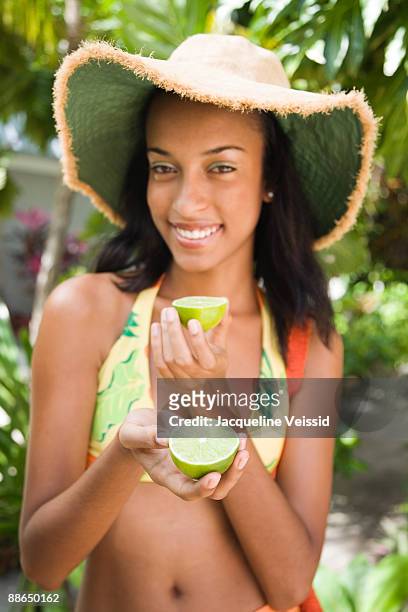 woman offering lime - the cayes stock pictures, royalty-free photos & images