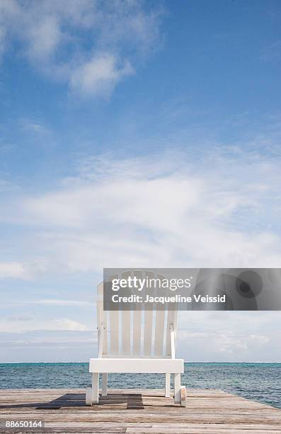 lounge chair on pier - the cayes stock pictures, royalty-free photos & images