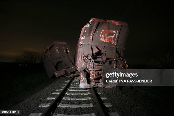Damaged freight train is seen after a train accident on December 05, 2017 in Meerbusch-Osterath, western Germany, where a passenger train and a...