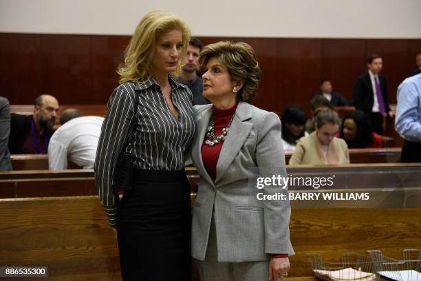 Summer Zervos , a former contestant on the television show "The Apprentice," listens to her lawyer Gloria Allred in New York County Criminal Court on...