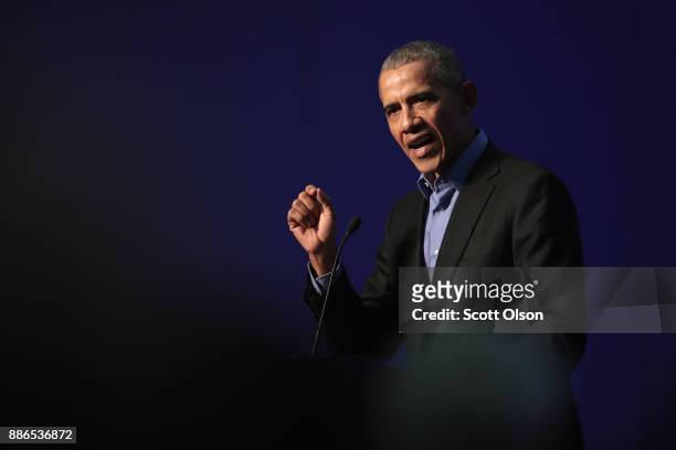 Former president Barack Obama speaks to a gathering of more than 50 mayors and other guests during the North American Climate Summit on December 5,...