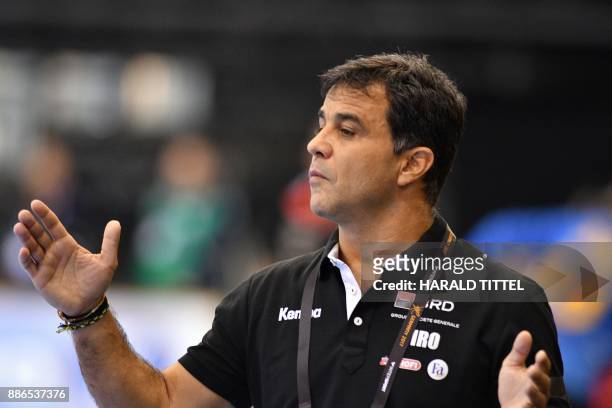 Romania's trainer Ambrosio Jose Martin Cedres gestures during the preliminary round IHF Womens World Championship handball match Romania versus Spain...