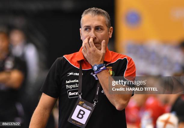 Spain's trainer Carlos Viver Arza gestures during the preliminary round IHF Womens World Championship handball match Romania versus Spain on December...