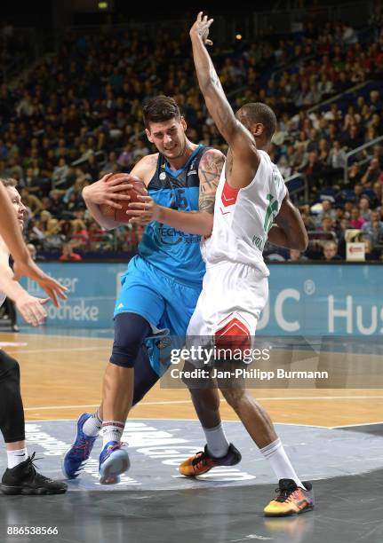 Bogdan Radosavljevic of Alba Berlin and Frank Elegar of Lokomotive Kuban during the EuroCup match between Alba Berlin and Lokomotive Kuban on...