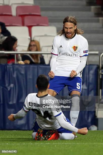 Basel's midfielder Mohamed Elyounoussi from Norway celebrates with Basel's defender Michael Lang from Suisse after scoring a goal during the UEFA...