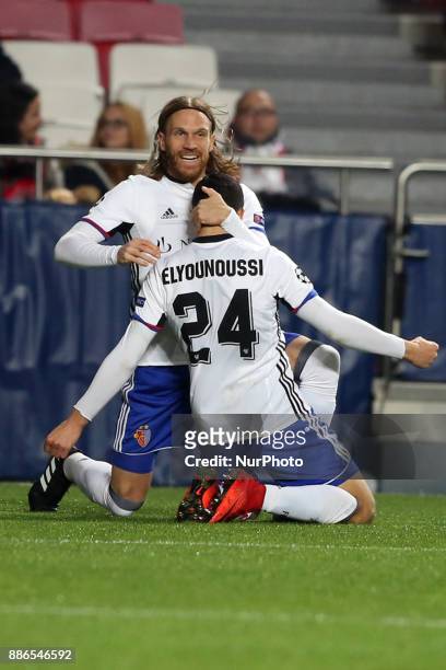 Basel's midfielder Mohamed Elyounoussi from Norway celebrates with Basel's defender Michael Lang from Suisse after scoring a goal during the UEFA...