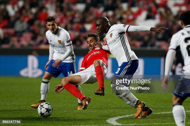 Benfica's forward Jonas vies for the ball with Basel's defender Eder Balanta during Champions League 2017/18 match between SL Benfica vs FC Basel, in...