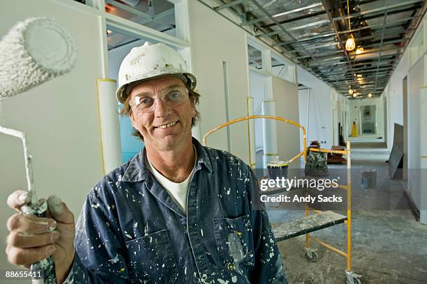 construction worker on job site - decorating stock pictures, royalty-free photos & images