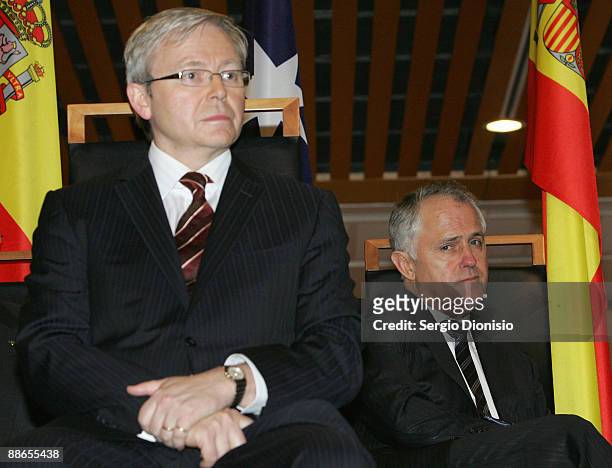 Australian opposition leader Malcom Turnbull keeps an eye on Australian Prime Minister Kevin Rudd during a reception for HRH King Juan Carlos I and...